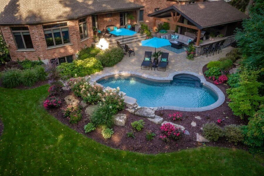 Inground pool installation with custom landscaping.