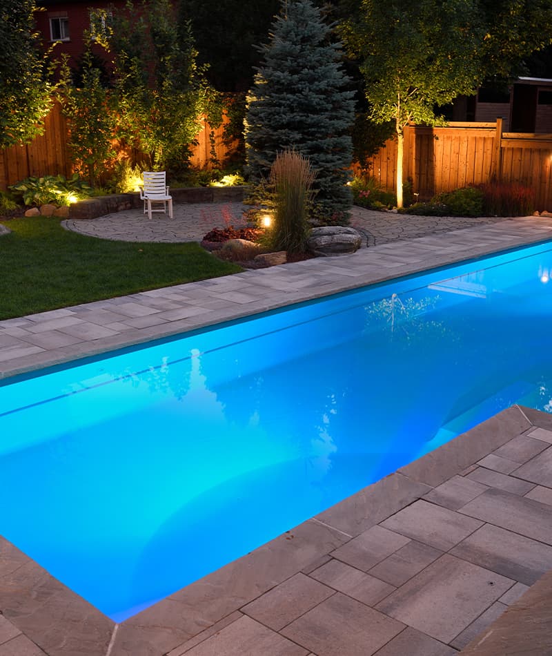 exterior pool and patio at night